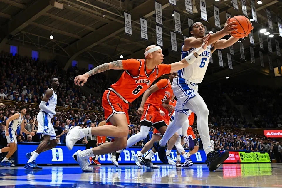 DURHAM, NORTH CAROLINA - FEBRUARY 28: Jacari White #6 of the Virginia Cavaliers battles Maliq Brown #6 of the Duke Blue Devils for a loose ball during the first half of the game at Cameron Indoor Stadium on February 28, 2026 in Durham, North Carolina. (Photo by Grant Halverson/Getty Images) | Getty Images